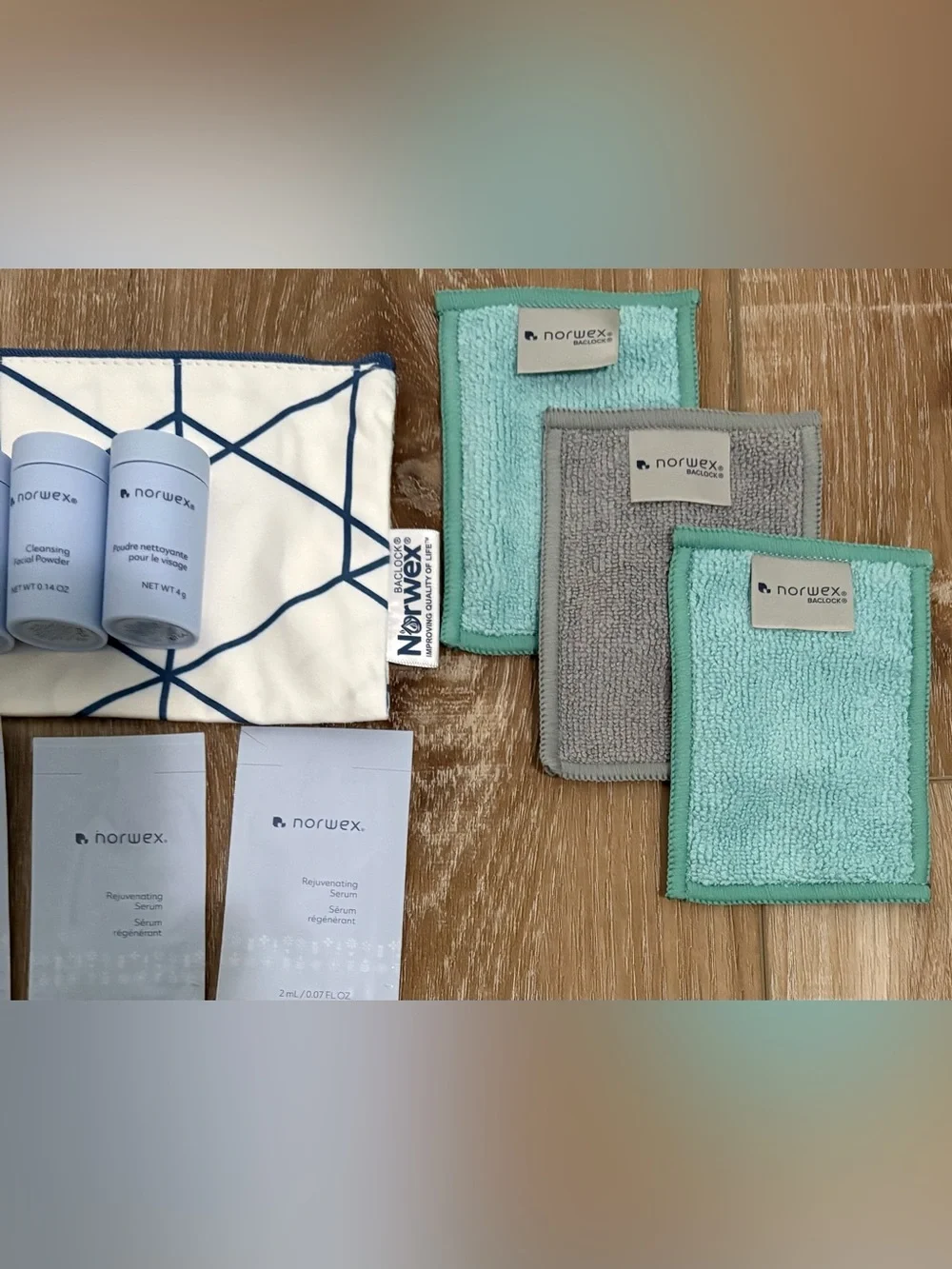NORWEX ( 3 ) FACIAL POWDER (4) SERUM PACKET  (3) BODY FACE CLOTHS & WRISTLET LOT